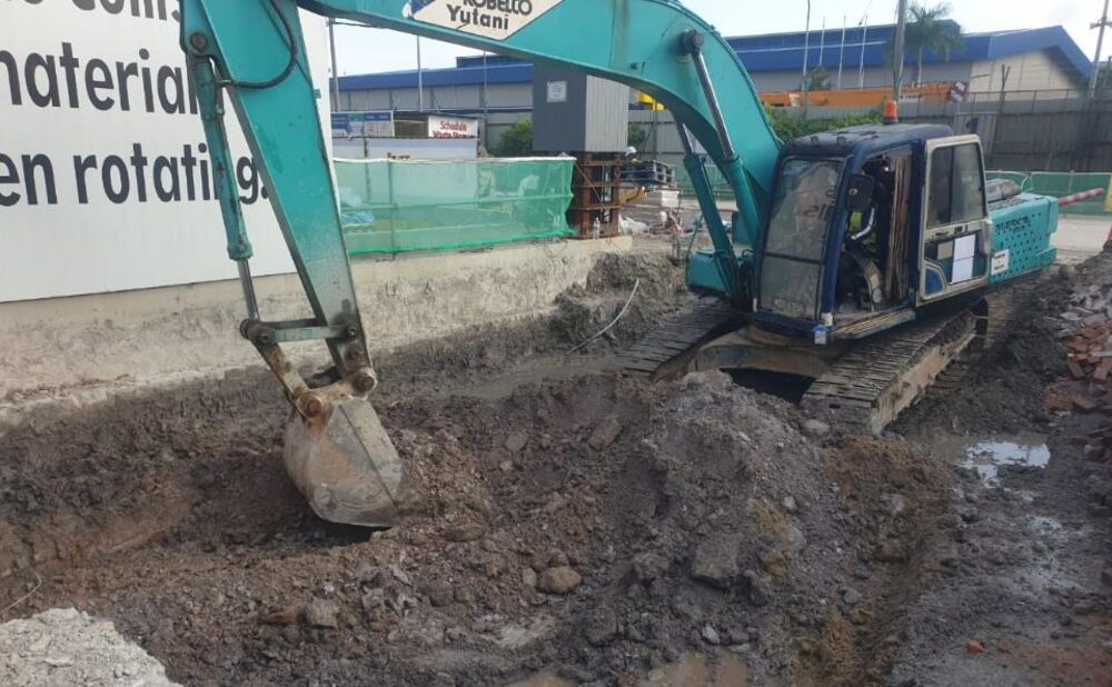 Reinforced concrete works crew on an active industrial floor slab