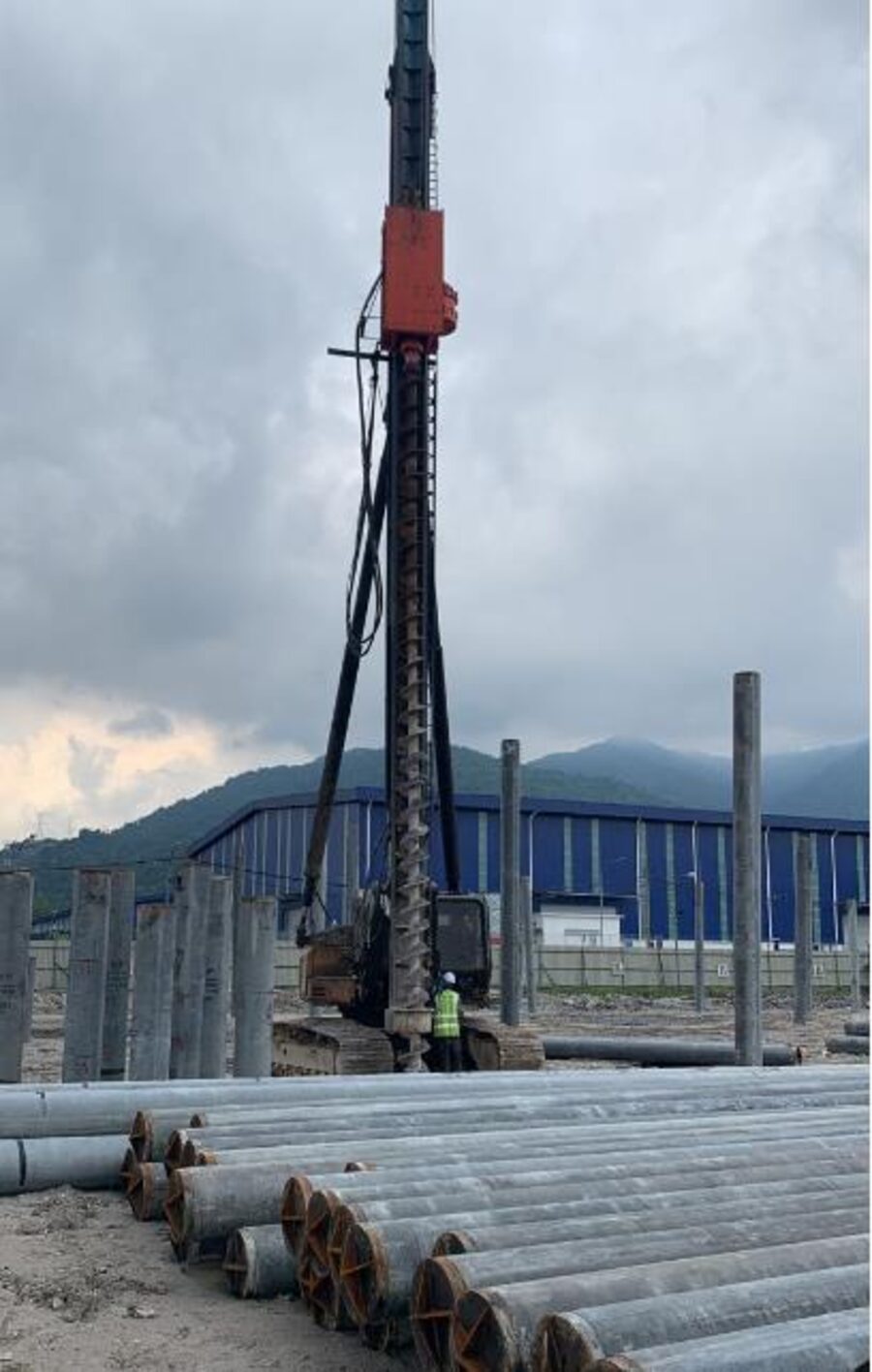 Site crew carrying out reinforced concrete works, verified before pour