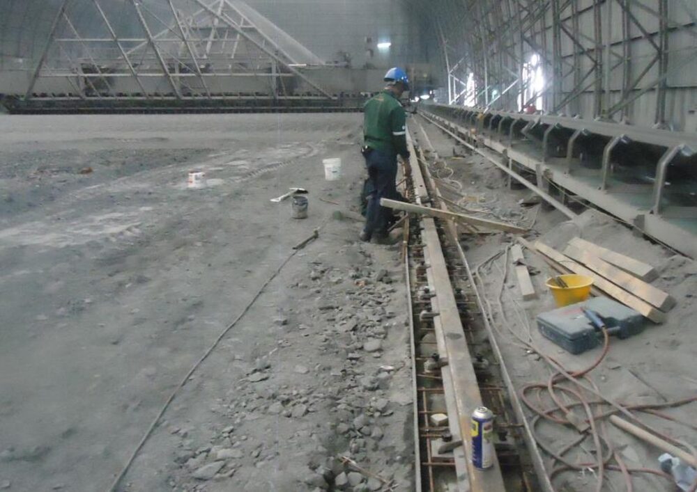 Plant reclaimer machine rail reconstruction at an industrial facility